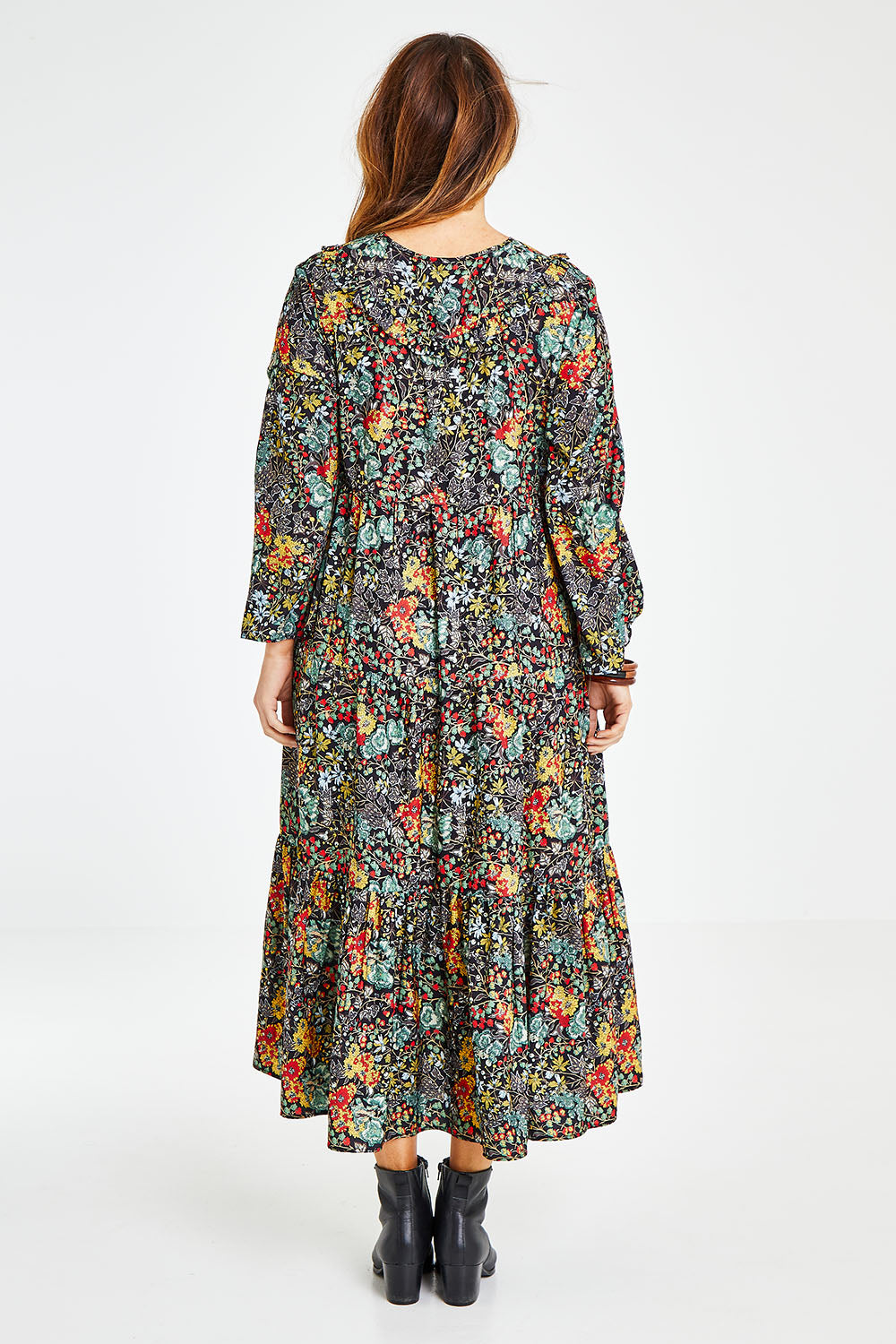 Model Laura wearing size 14 of the Field Of Flowers Dress in colour Black (Black), from the back