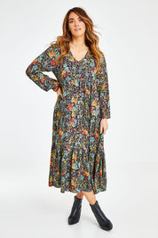 Model Laura wearing size 14 of the Field Of Flowers Dress in colour Black (Black), from the front, showing the whole outfit