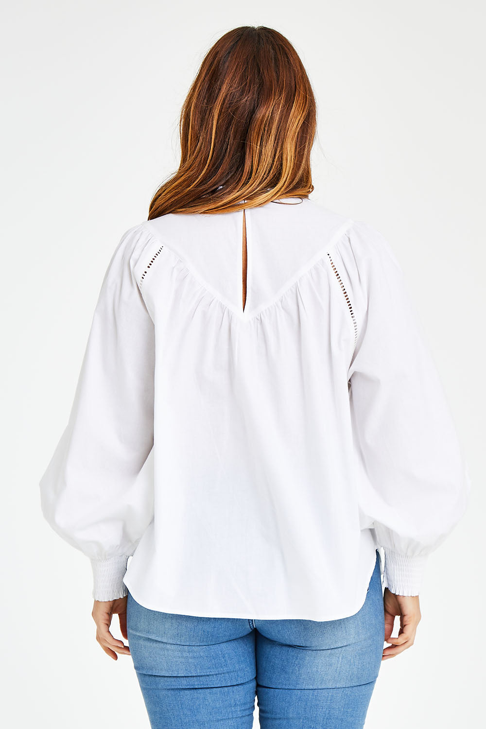 Model Laura wearing size 14 of the Lady Whistledown Blouse in colour White (White), from the back