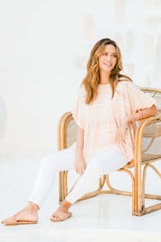 Model Ilona wearing size 10 of the Perfect As You Are Stripe Top in colour Peach (Pink), from the front, showing the whole outfit