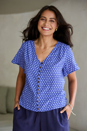 Model Tahnee wearing size 10 of the Cute As A Button Printed Blouse in colour Bluefleur (Blue), from the front, showing the whole outfit
