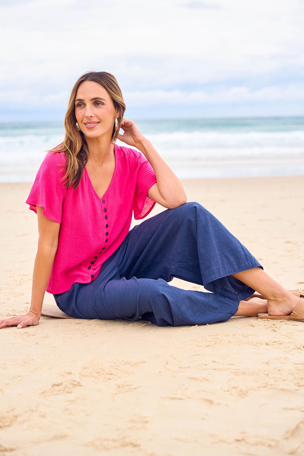 Model Tegan wearing size 10 of the Cute As A Button Blouse in colour Hotpink (Pink), from the front, showing the whole outfit