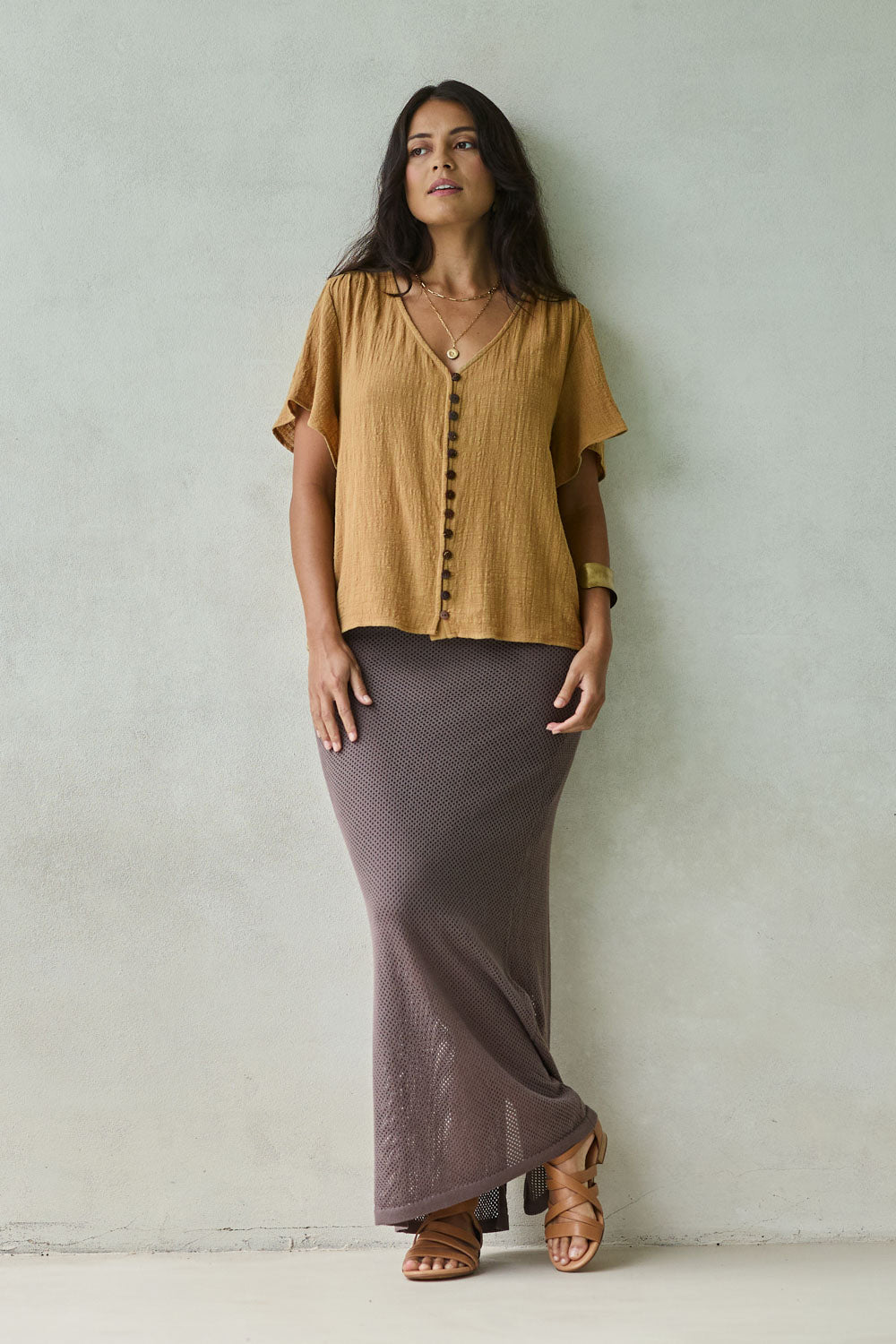 Model Tahnee wearing size 10 of the Cute As A Button Blouse in colour Khaki (Green), from the front, showing the whole outfit