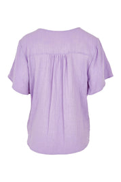 Product shot of the Cute As A Button Blouse in colour Lavender (Purple), from the back