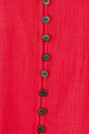 Product shot of the Cute As A Button Blouse in colour Red (Red), detail