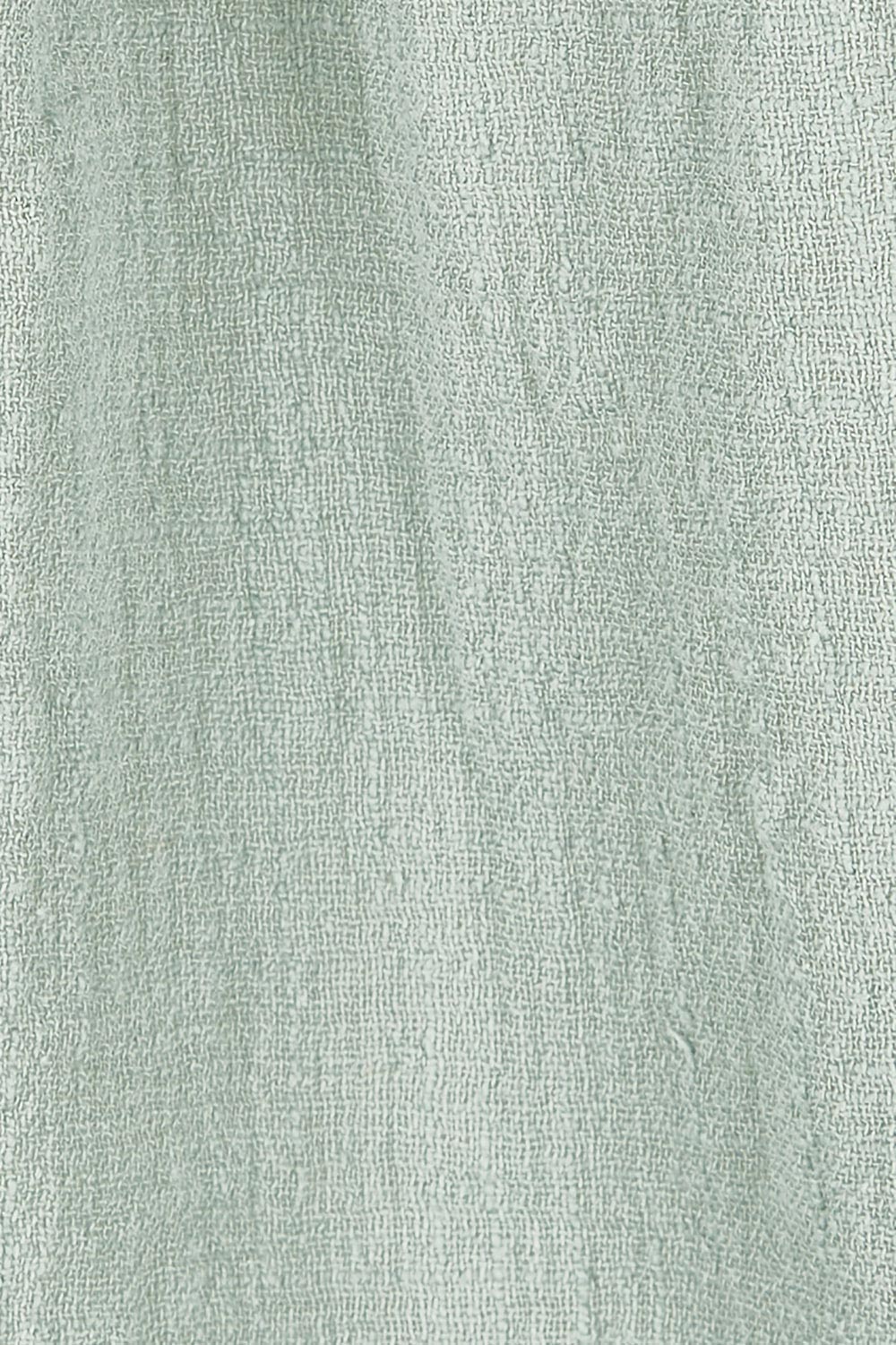 Product shot of the Cute As A Button Blouse in colour Sage (Green), detail