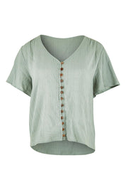 Product shot of the Cute As A Button Blouse in colour Sage (Green), from the front