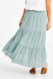 Model Laura wearing size 14 of the Cute As A Button Skirt in colour Sage (Green), from the front, cropped image