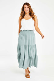 Model Laura wearing size 14 of the Cute As A Button Skirt in colour Sage (Green), from the front, showing the whole outfit