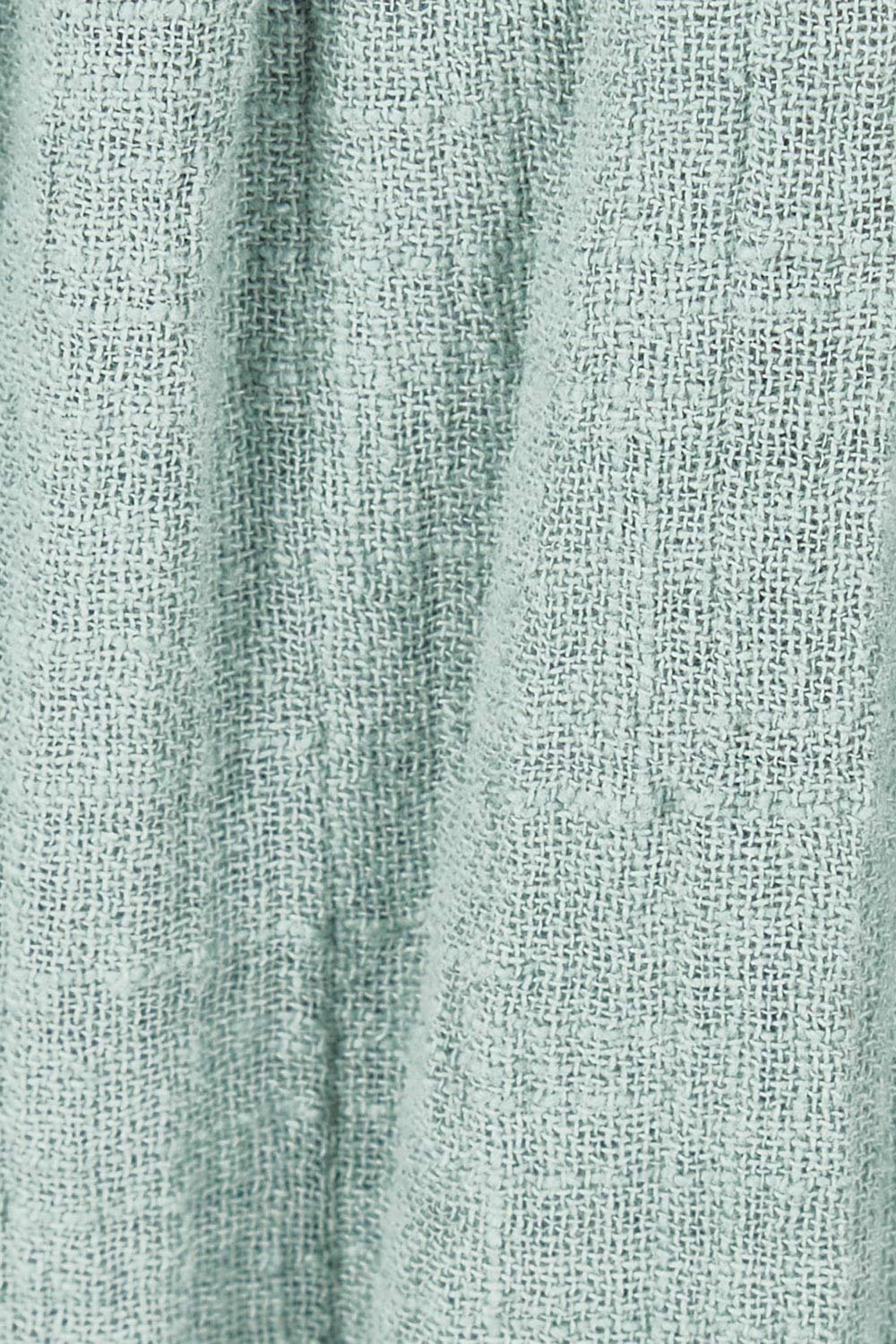 Product shot of the Cute As A Button Skirt in colour Sage (Green), detail