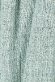 Product shot of the Cute As A Button Skirt in colour Sage (Green), detail
