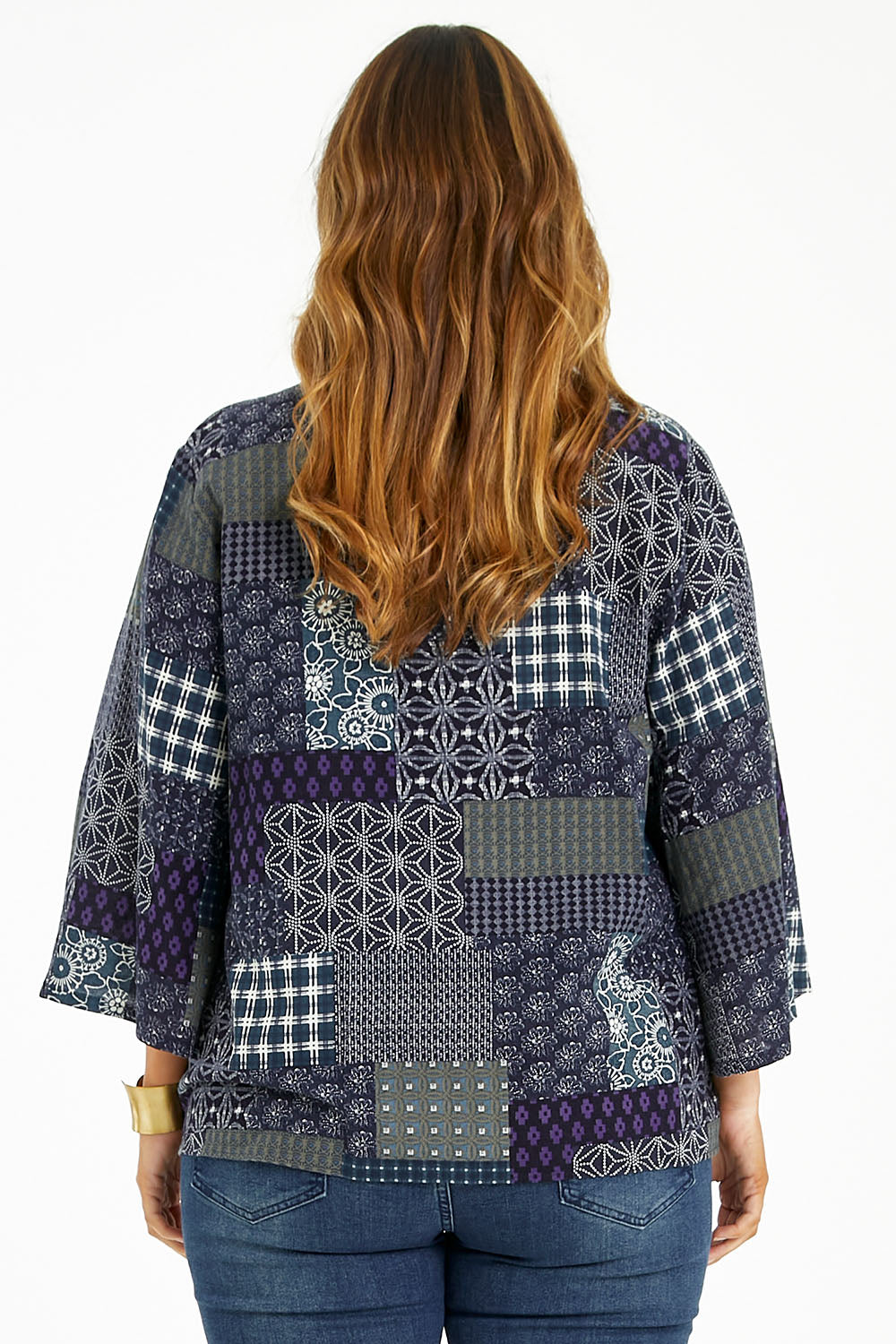 Model Laura wearing size 14 of the You Colour My World Kimono in colour Patch (Blue), from the back
