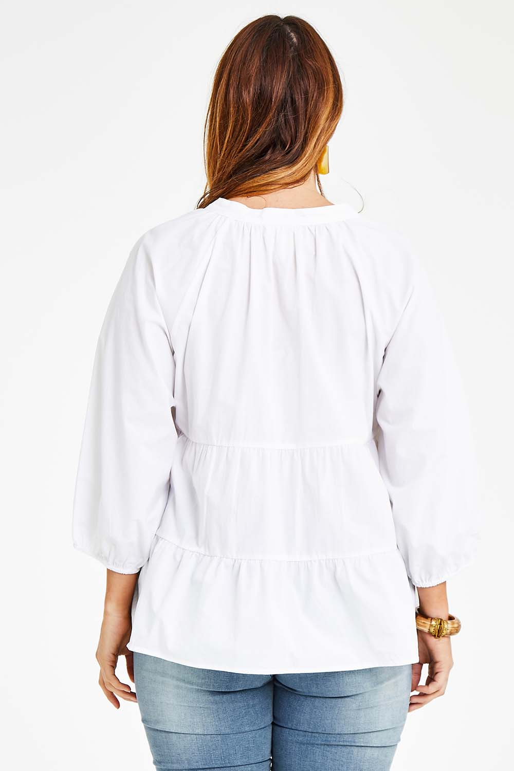 Model Laura wearing size 14 of the Cruising On By Tiered Blouse in colour White (White), from the back