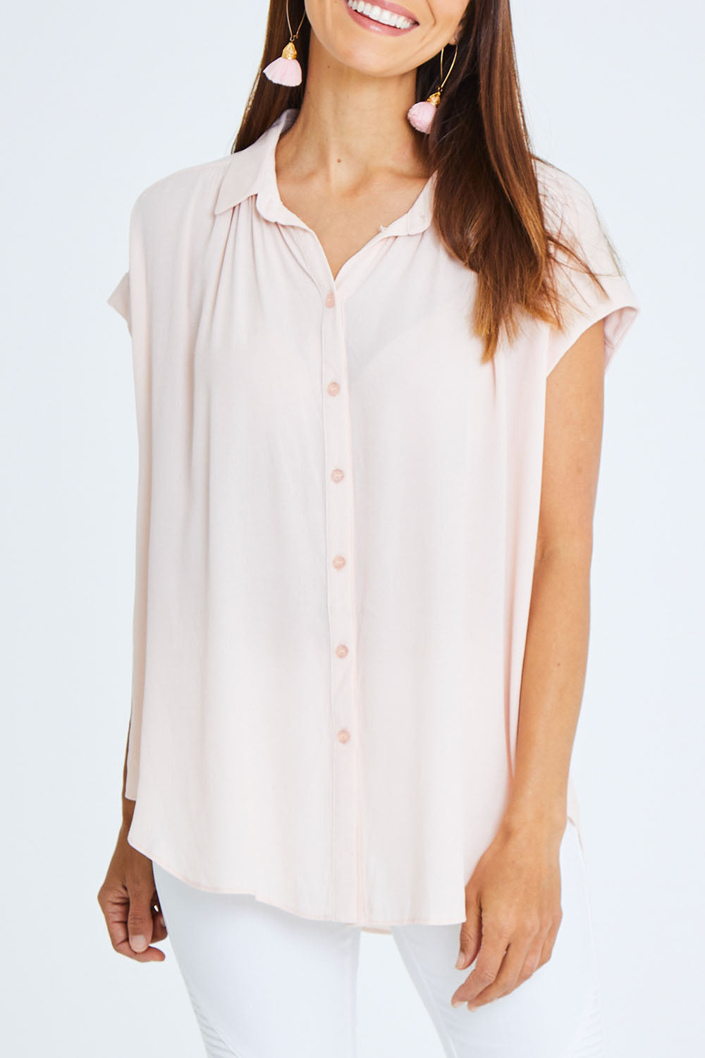 Model Cara wearing size 10 of the Go Your Own Way Button Blouse in colour Blush (Pink), from the front, cropped image