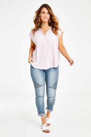 Model Laura wearing size 14 of the Go Your Own Way Button Blouse in colour Blush (Pink), from the front, showing the whole outfit
