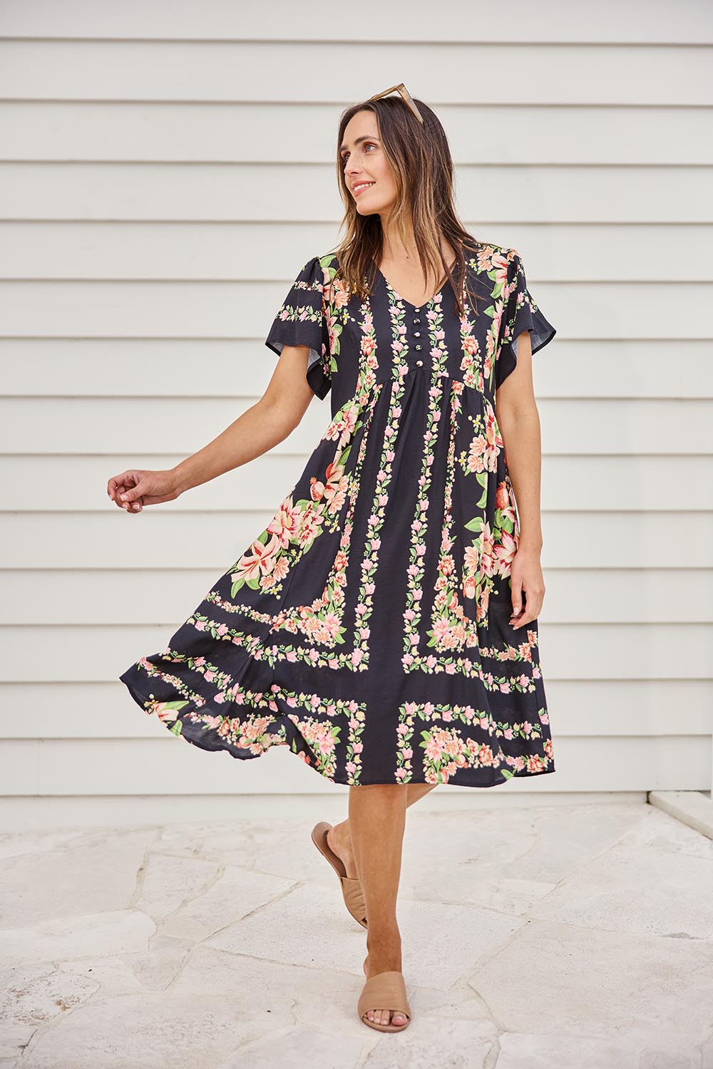 Model Tegand wearing size 10 of the Love Shack Midi Dress – Blackfleur in colour Blackfleur, from the front