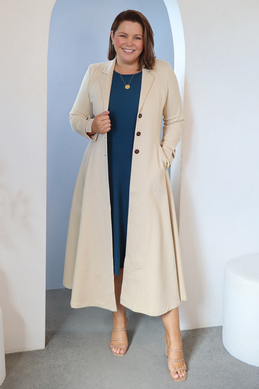 Model Stacey wearing size 14 of the Meet Me At Midnight Longline Ponte Coat in colour Sand, from the front, showing the whole outfit