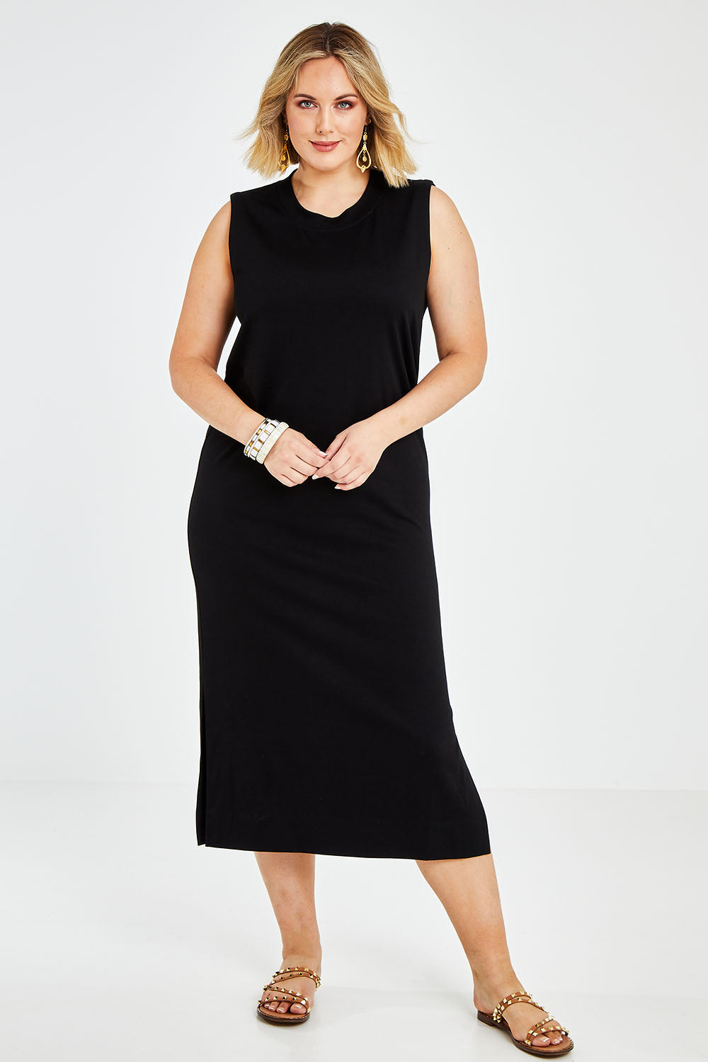 Model Jess wearing size 14 of the Ready For Anything Tank Dress in colour Black (Black), from the front, showing the whole outfit