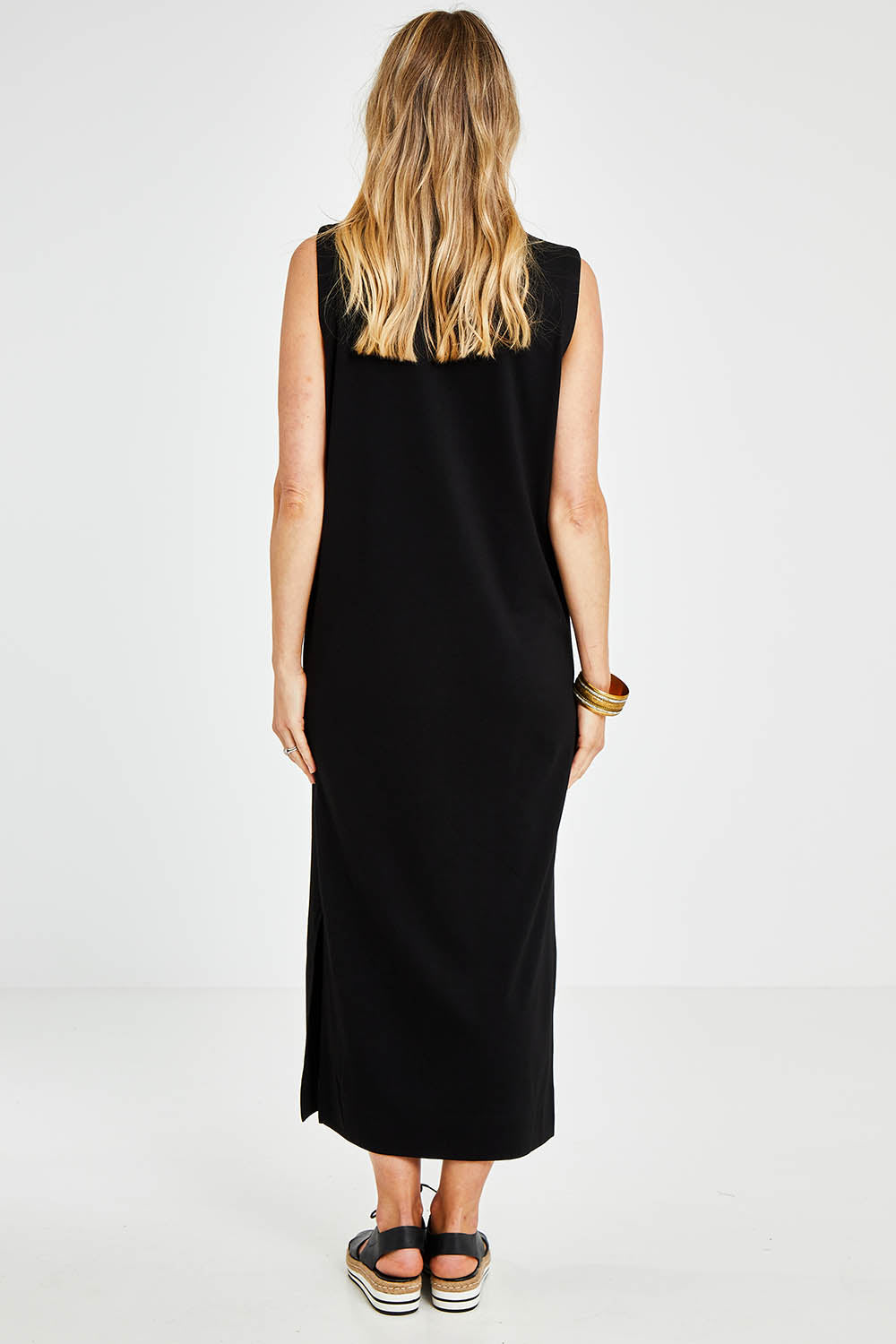 Model Kelly wearing size 10 of the Ready For Anything Tank Dress in colour Black (Black), from the back