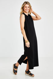 Model Kelly wearing size 10 of the Ready For Anything Tank Dress in colour Black (Black), from the front, showing the whole outfit