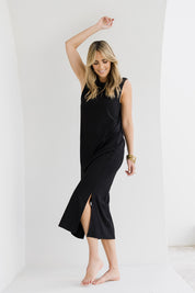 Model Tegan wearing size 10 of the Ready For Anything Tank Dress in colour Black (Black), from the front, showing the whole outfit