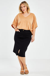 Model Jess wearing size 14 of the Hold My Hand Denim Skirt in colour Black (Black), from the front, showing the whole outfit