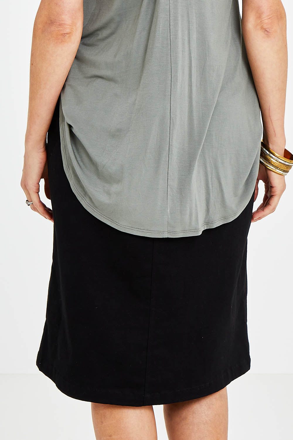 Model Kelly wearing size 10 of the Hold My Hand Denim Skirt in colour Black (Black), from the back