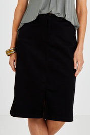 Model Kelly wearing size 10 of the Hold My Hand Denim Skirt in colour Black (Black), from the front, cropped image