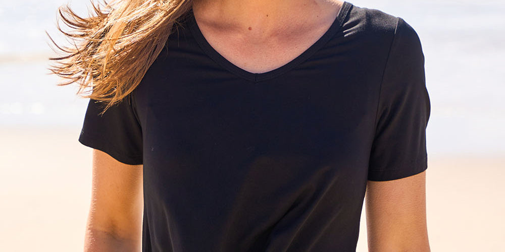 Model Tegan wearing size 10 of the Softly Swinging Bamboo Tee in colour Black (Black), from the front, showing the whole outfit