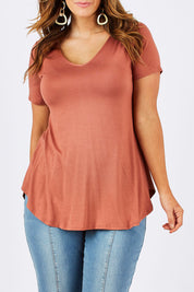 Model Laura wearing size 12 of the Softly Swinging Bamboo Tee in colour Copper, from the front, cropped image
