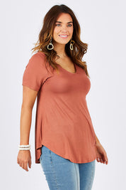 Model Laura wearing size 12 of the Softly Swinging Bamboo Tee in colour Copper, from the front, cropped image
