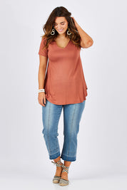 Model Laura wearing size 12 of the Softly Swinging Bamboo Tee in colour Copper, from the front, showing the whole outfit