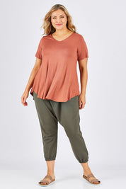 Model Ljubenka wearing size 18 of the Softly Swinging Bamboo Tee in colour Copper, from the front, showing the whole outfit