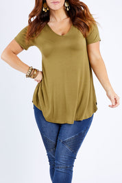 Model Laura wearing size 14 of the Softly Swinging Bamboo Tee in colour Olive (Green), from the front, cropped image