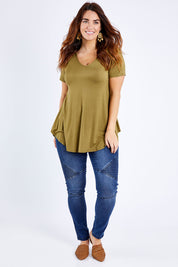 Model Laura wearing size 14 of the Softly Swinging Bamboo Tee in colour Olive (Green), from the front, showing the whole outfit