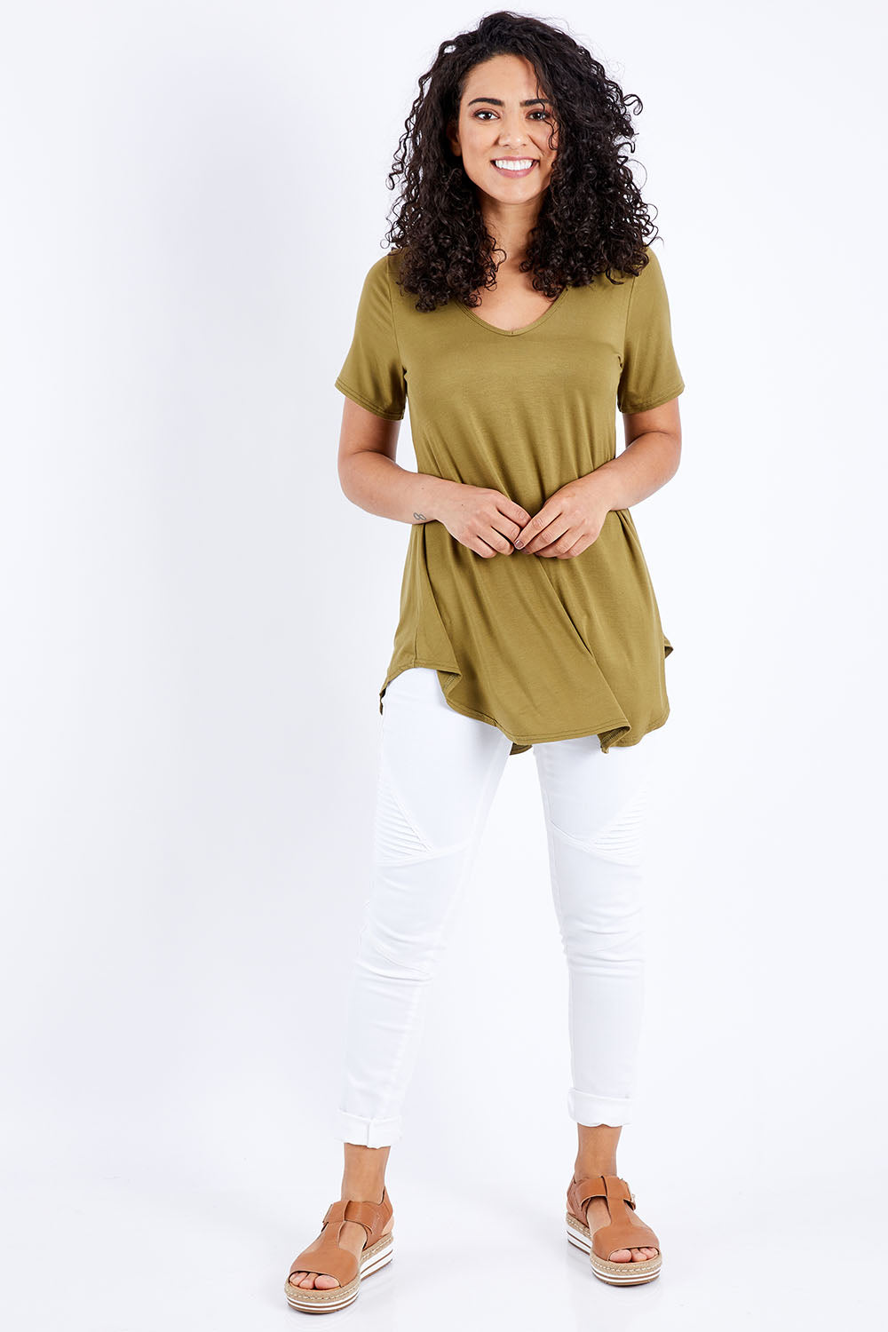 Model Pamela wearing size 10 of the Softly Swinging Bamboo Tee in colour Olive (Green), from the front, showing the whole outfit
