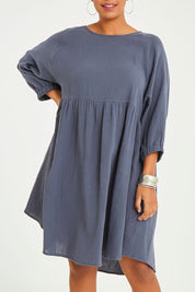 Model Noli wearing size 14 of the Feeling Free Cotton Smock Dress in colour Smoke (Grey), from the front, cropped image