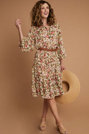 Model Emma wearing size 10 of the Floating Through The Day Dress in colour Garden (Pink), from the front, showing the whole outfit