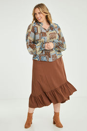 Model Jess wearing size 14 of the Not A Patch On You Blouse in colour Tealpatch (Blue), from the front, showing the whole outfit