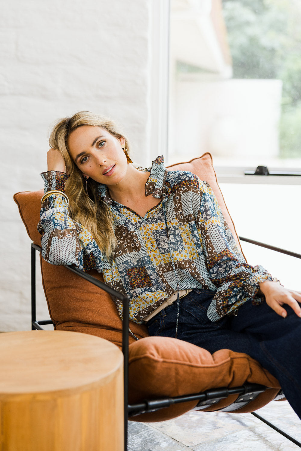 Model Tegan wearing size 10 of the Not A Patch On You Blouse in colour Tealpatch (Blue), from the front, showing the whole outfit