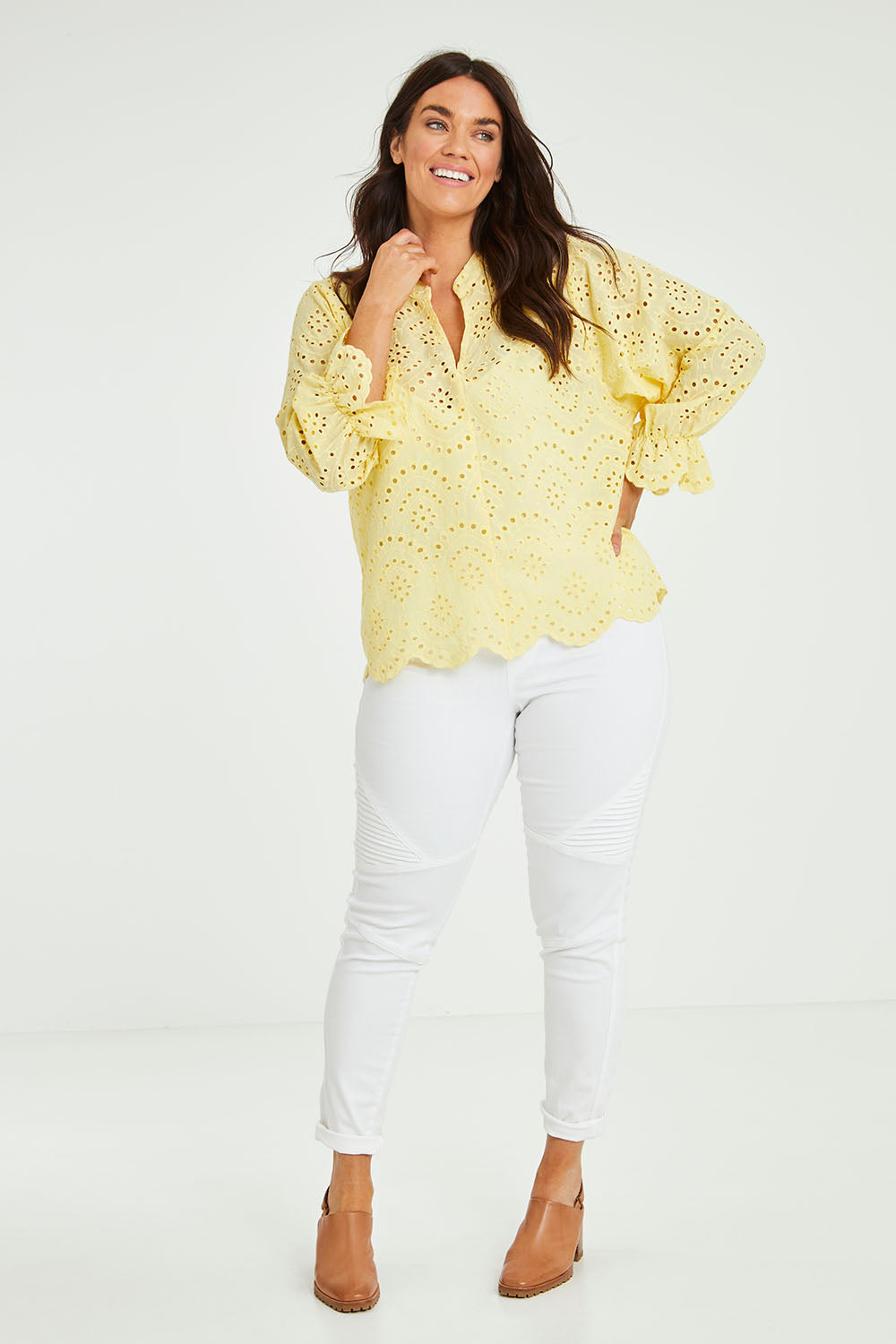 Model Laura wearing size 14 of the Sweet Pea Broderie Blouse in colour Sun, from the front, showing the whole outfit
