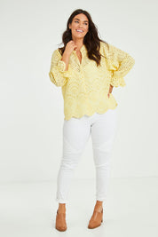 Model Laura wearing size 14 of the Sweet Pea Broderie Blouse in colour Sun, from the front, showing the whole outfit