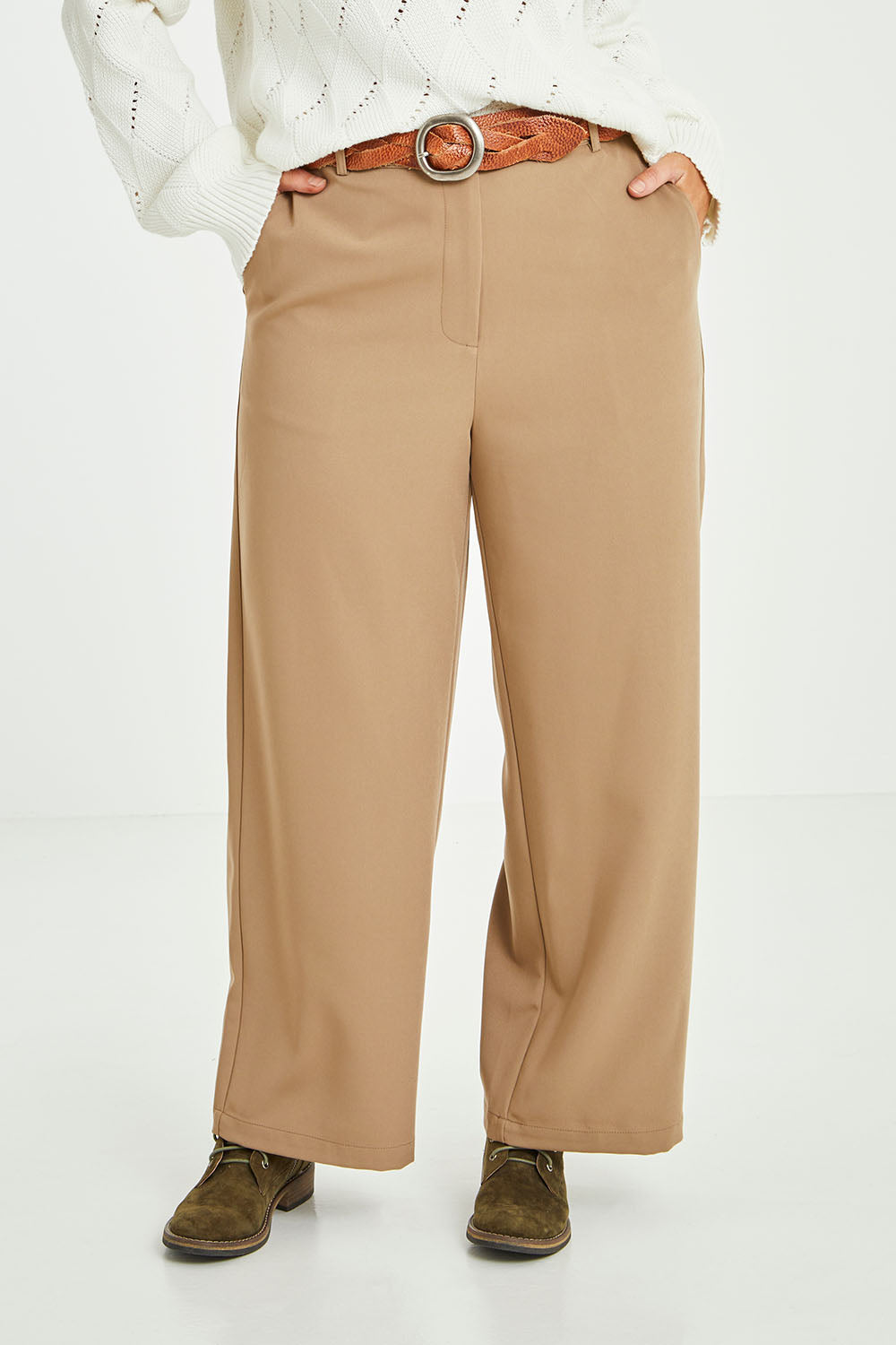 Model Laura wearing size 14 of the All For Love Pants in colour Camel, from the front, cropped image