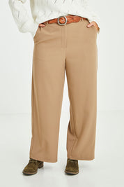 Model Laura wearing size 14 of the All For Love Pants in colour Camel, from the front, cropped image