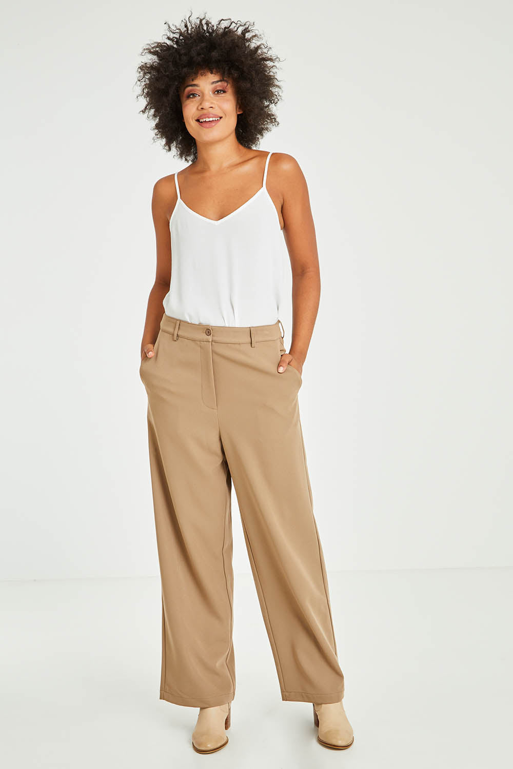 Model Olivia wearing size 10 of the All For Love Pants in colour Camel, from the front, showing the whole outfit