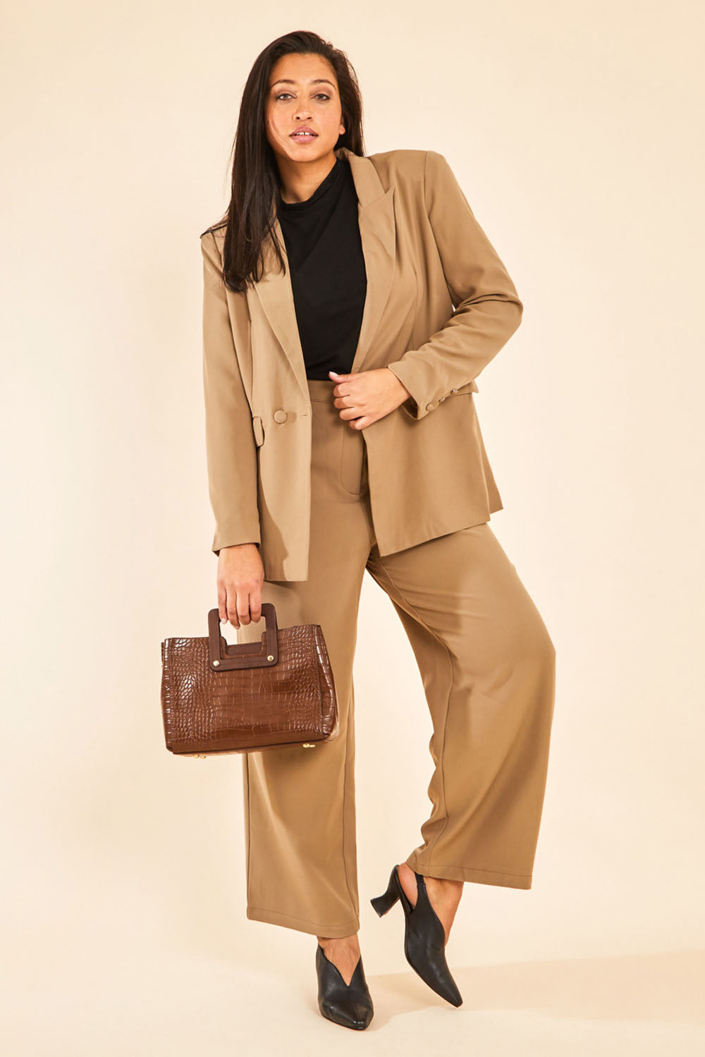 Model Terri-Leigh wearing size 14 of the All For Love Pants in colour Camel, from the front, showing the whole outfit