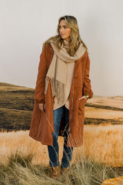 Model Tegan wearing size 10 of the Heart Warming Quilted Anorak in colour Rust, from the front, showing the whole outfit
