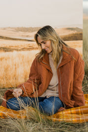 Model Tegan wearing size 10 of the Heart Warming Quilted Anorak in colour Rust, from the front, showing the whole outfit