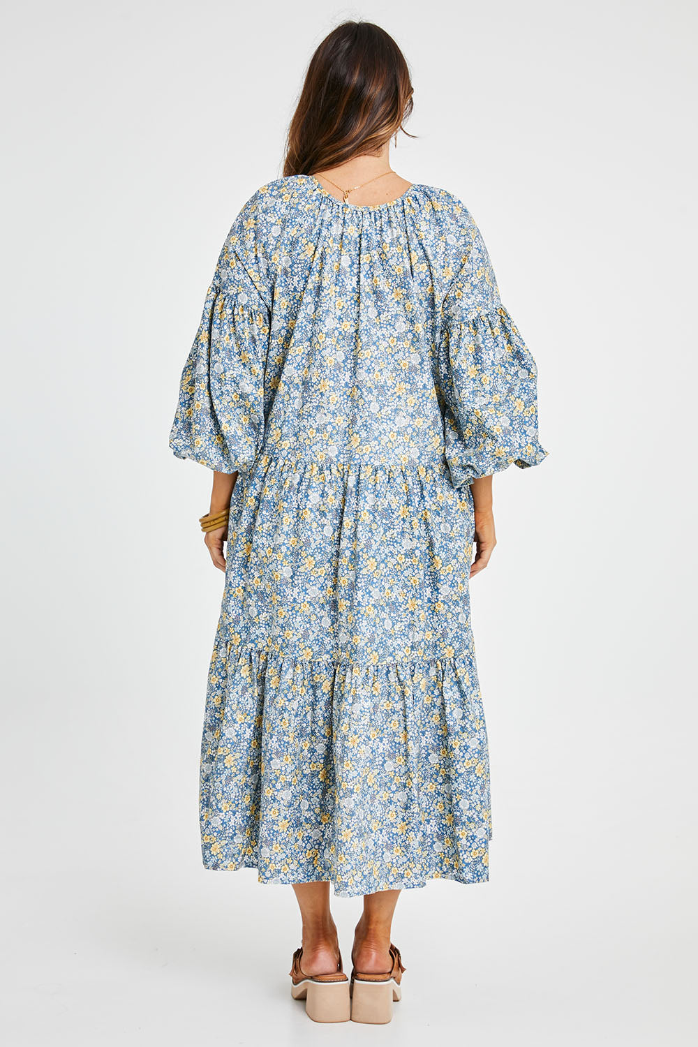 Model Laura wearing size 14 of the Light Of The Sun Cotton Dress in colour Bluefleur (Blue), from the back