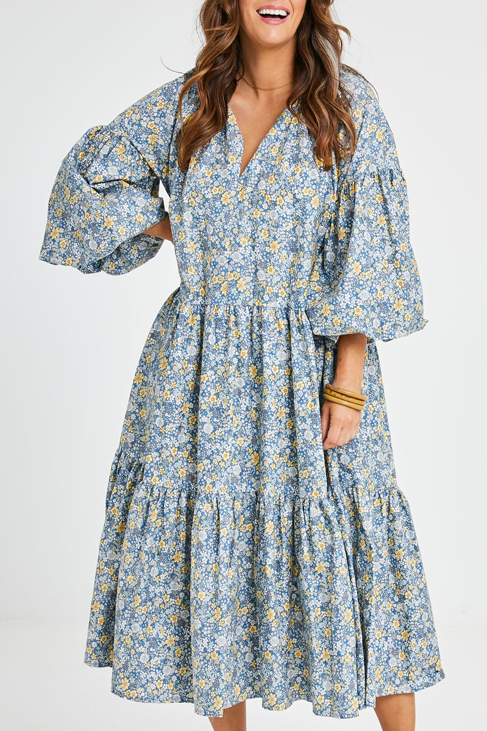Model Laura wearing size 14 of the Light Of The Sun Cotton Dress in colour Bluefleur (Blue), from the front, cropped image
